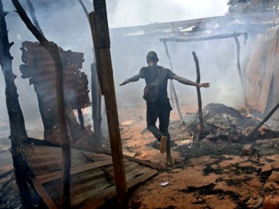 The home of an Indian Christian family is burned down by militants. The home of an Indian Christian family is burned down by militants.